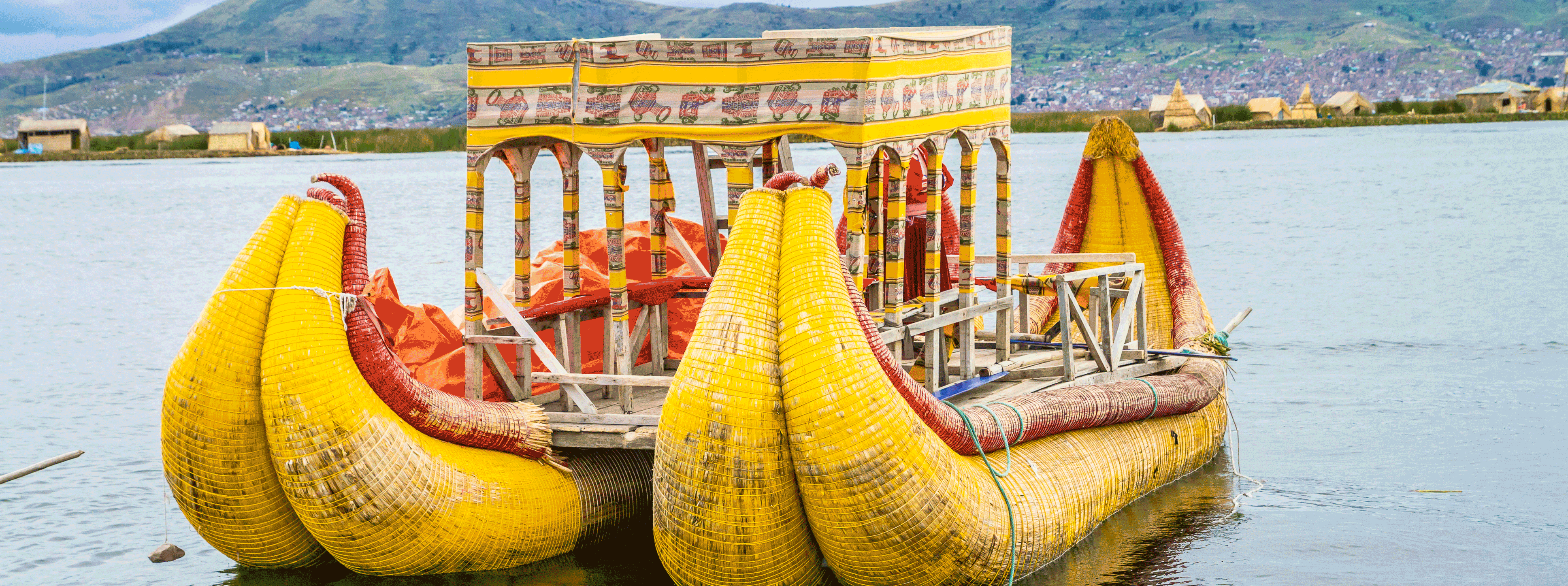 /resource/Images/southamerica/peru/headerimage/Traditional-boats-in-the-floating-and-tourist-Islands-of-lake-Titicaca-Puno-Peru-South-America.png